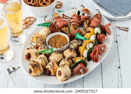 A platter of appetizers ready for sharing during a Super bowl celebration Royalty-Free Stock Photo #2409327317