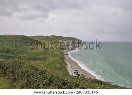 The picture was taken during an adventurous hike during late summer 2023. It represents the green coastline between the wonderful French town of Etretat and Cap d-Antifer before a rainy storm arrived 