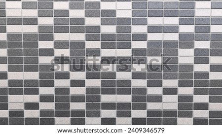dark grey and beige random pattern tiles