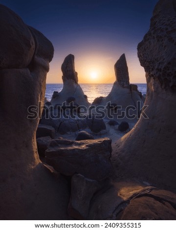 Heping Island GeoPark, Keelung City, Taiwan.Spotted these amazing rock pillars as perfect framing and they looked like a portal of time! Royalty-Free Stock Photo #2409355315