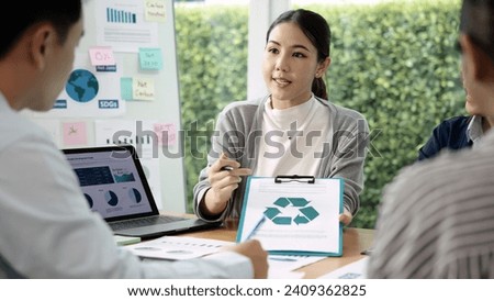 Carbon offset price report CO2 emission. Future growth Net zero waste in ESG ethical SME office protect climate change global warming social issues project. Group of asia people Eco friendly SDGs plan Royalty-Free Stock Photo #2409362825