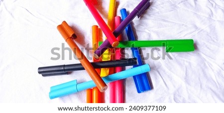 coloring pen isolated on white background, photographed close up indors.