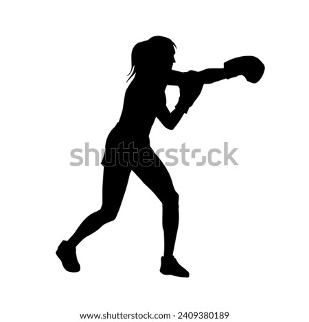 Silhouette of woman boxing athlete in action pose. Silhouette of a female wearing boxing gloves for boxing sport. Royalty-Free Stock Photo #2409380189