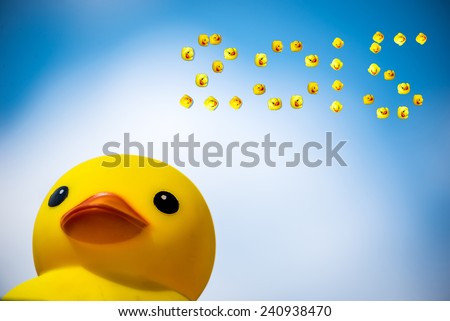 Happiness yellow rubber duck amd blue sky,happy new year 2015