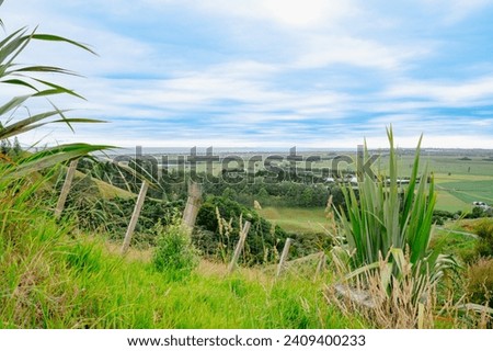 Rural and coastal expansive view from Papamoa Hills Regional Park in Bay of Plenty New Zealand. Royalty-Free Stock Photo #2409400233
