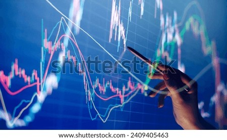 Businesswoman manually drawing a diagram on a touch screen interface. Royalty-Free Stock Photo #2409405463