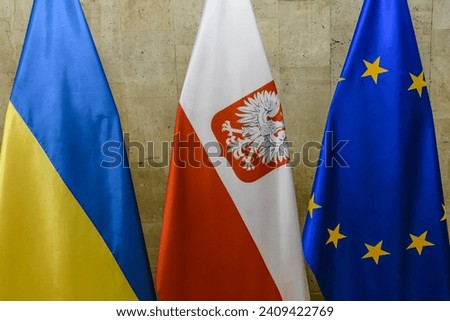 National flags of Ukraine and Poland and the flag of the European Union