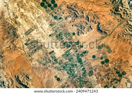 Agriculture in Mexicos Chihuahuan Desert. The fertile flood plains around the San Miguel River are conducive to maize and other agricultural. Elements of this image furnished by NASA.