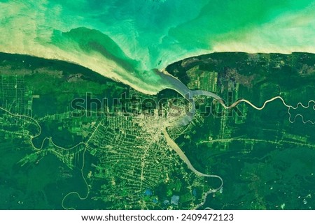 Paramaribo, Suriname. The capital city, once a Dutch trading post, hugs the banks of the Suriname River. Elements of this image furnished by NASA.