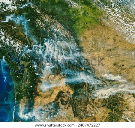 Smoke in the Pacific Northwest. Extreme heat, bouts of strong winds, and a prolonged drought are fueling large forest fires in western Canada. Elements of this image furnished by NASA.
