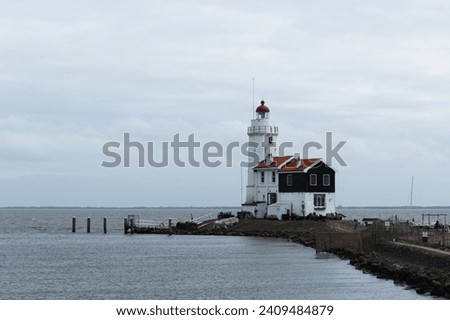 Lonely lighthouse. Iconic Paard van Marken Lighthouse, a historic beacon situated on the Dutch peninsula of Marken in North Holland.