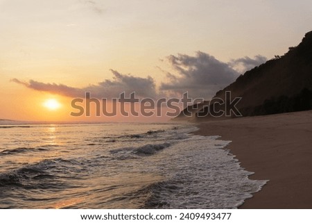 Tropical sunset on the beach of Bali island