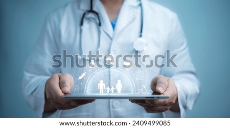 A medical worker using  tablet with virtual health care icons, medical technology background, health insurance business.Health Insurance, telemedicine, virtual hospital, family medicine concept. 