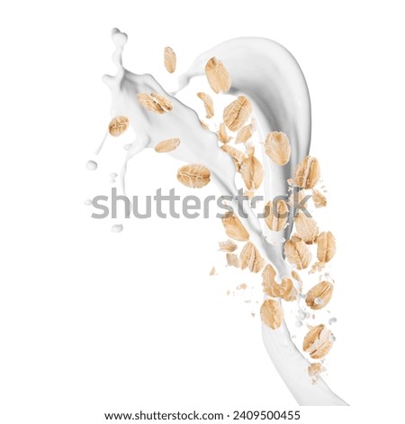 Rolled oats and milk splash isolated on white Royalty-Free Stock Photo #2409500455