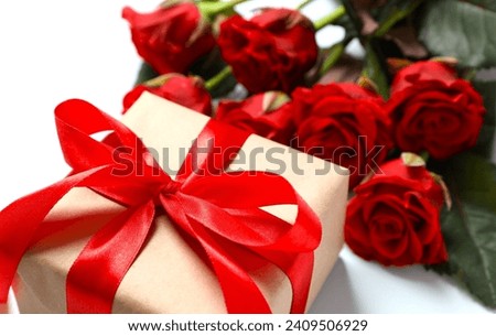 Beautiful gift with a red bouquet of roses