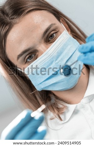 A professional dentist in her dental office is image of real expert who combines warmth and confidence. With attention to detail and a smile, she guides her patients through every stage of treatment. Royalty-Free Stock Photo #2409514905
