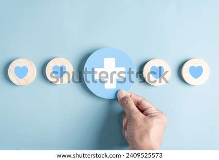 Health insurance and medical welfare concept. people hands holding plus symbol and healthcare medical icon, health and access healthcare. Royalty-Free Stock Photo #2409525573