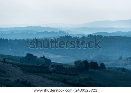 Typical Tuscan landscape near San Gimignano, Italy Royalty-Free Stock Photo #2409525921