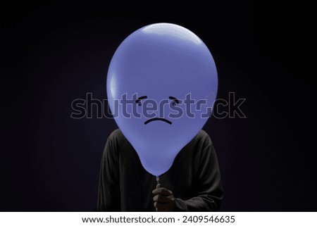 Mental Health Concept. a Stressed, Anxiety, Depressed Person with a Balloon, Negative Emotion and Feeling. Moody. Dark tone Royalty-Free Stock Photo #2409546635