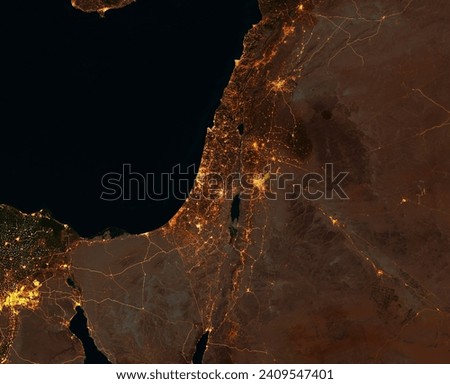 Night satellite view of Israel, Gaza Strip, West Bank, Lebanon, Syria, Jordan and Egypt. City and street lights. Elements of this image are furnished by Nasa Royalty-Free Stock Photo #2409547401