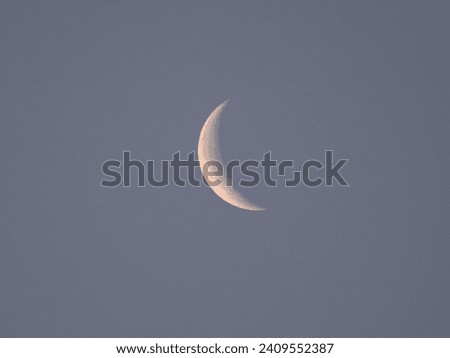 Crescent moon on a clear morning sky