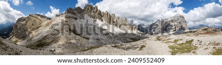 Valley Val Travenanzes and rock face in Tofane gruppe, Mount Tofana de Rozes, Alps Dolomites mountains, Fanes national park, Italy Royalty-Free Stock Photo #2409552409