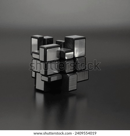 Reflective Elegance Mesmerizing Mirror Cube or Silver Cube or Bump Cube on Black Background Abstract 3D Puzzle Toy Creating Stunning Visual Harmony Perfect for Design and Conceptual Projects