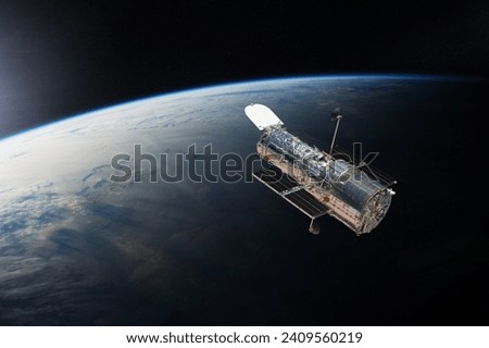 The Hubble space telescope in outer space. Elements of this image furnished by NASA. Royalty-Free Stock Photo #2409560219
