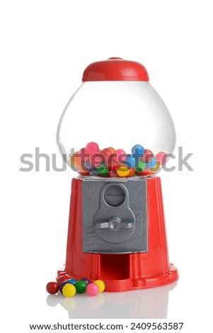 plastic toy gumball machine with colorful gum Royalty-Free Stock Photo #2409563587