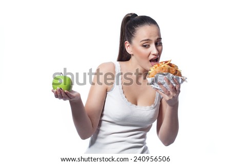 Woman choosing between healthy and unhealthy eating.