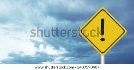 Hurricane Idalia warning sign against a powerful stormy background with copy space. Dirty and angled sign with cyclonic winds add to the drama.hurricane season sign on cloudy background Royalty-Free Stock Photo #2409590407