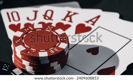 Stack of poker chips for high-stakes casino games Royalty-Free Stock Photo #2409608853