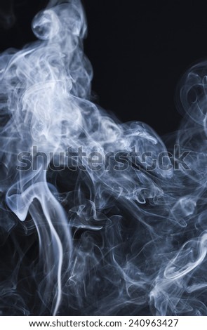 Abstract colored  smoke on a dark background.