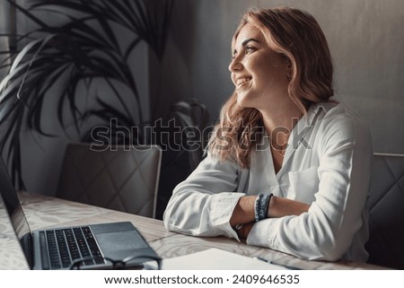 Smiling young caucasian business woman head shot portrait. Thoughtful millennial businesswoman looking away with pensive face, dreaming, thinking over project tasks, future lifestyle