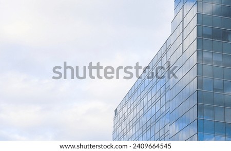 Dynamic modern cityscape with towering commercial buildings against a vibrant sky Royalty-Free Stock Photo #2409664545