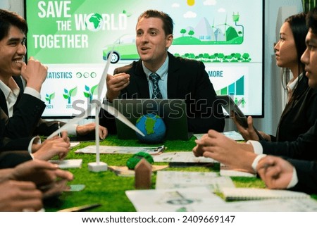 Diverse group of business people planning for alternative energy utilization for greener sustainable Earth by reducing CO2 emission and carbon credit with renewable clean energy technology. Quaint Royalty-Free Stock Photo #2409669147