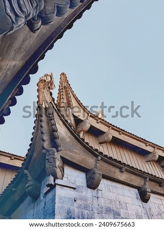 Beautiful traditional decorations and details on the roof of the temple at Vinh Nghiem monastery in Ho Chi Minh city, Vietnam. Religion concept.
