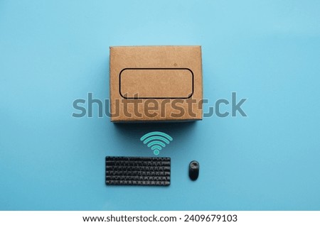 A picture of keyboard, mouse and wifi symbol with carton box. Search item for online shopping