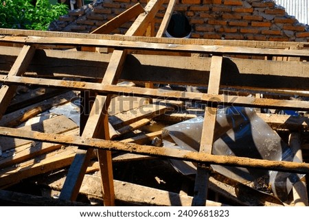 Industrial Photography. Construction works. Photo of dismantling the roof of a house. Dismantling the roof of a house to install a new roof. Bandung - Indonesia, Asia