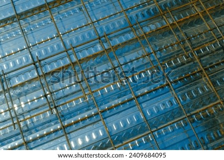 Industrial Photography. Construction works. Textured Background of wiremesh installed on top of the metal deck. Installation of wire mesh on the metal deck before casting the floor. Bandung, Indonesia