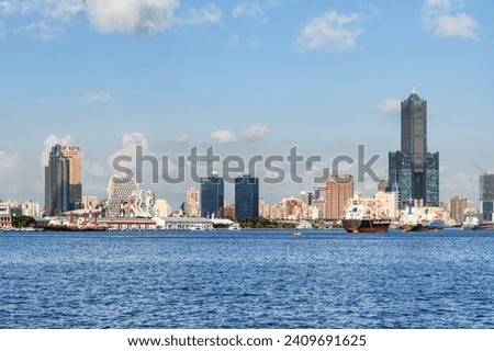 Awesome Kaohsiung skyline, Taiwan. Amazing view of Kaohsiung Harbor, 85 Sky Tower (Tuntex Sky Tower) and other modern buildings of downtown. The skyscraper is a landmark of Taiwan. Scenic cityscape. Royalty-Free Stock Photo #2409691625