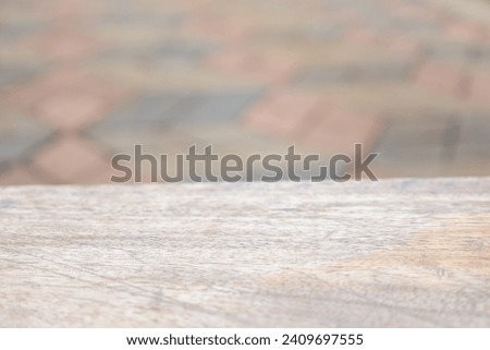 Wooden table top on blurred grey background with bokeh. Copy space for your display or montage product design.