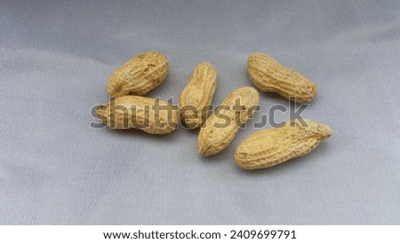 this is a picture of a peanuts on a white background
