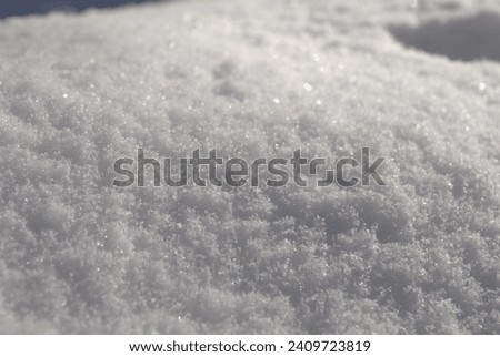 winter image. Fresh snow texture background material on a sunny day.