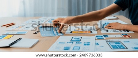 Panorama banner of startup company employee planning on user interface prototype for mobile application or website in office. UX UI designer brainstorm user friendly interface plan. Synergic Royalty-Free Stock Photo #2409736033