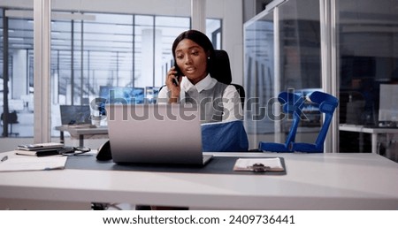 African American with Injured Leg Uses Crutches Royalty-Free Stock Photo #2409736441