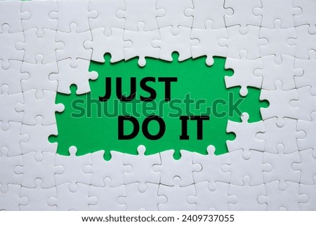 Just do it symbol. Concept words Just do it on white puzzle. Beautiful green background. Business and Just do it concept. Copy space.