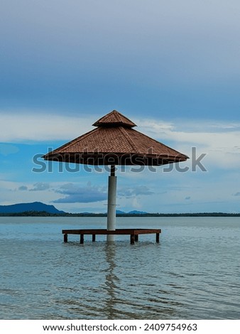View of the beach on Leebong Island, Belitung, Indonesia with a gazebo surrounded by sea water