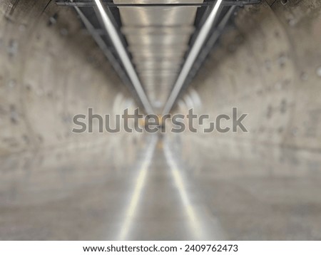 Blurry underground passage across the road looks like a Sci Fi tunnel to a spaceship.:Use for website banner background,backdrop