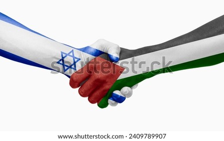 Handshake between Israel and Palestine flags painted on hands Royalty-Free Stock Photo #2409789907